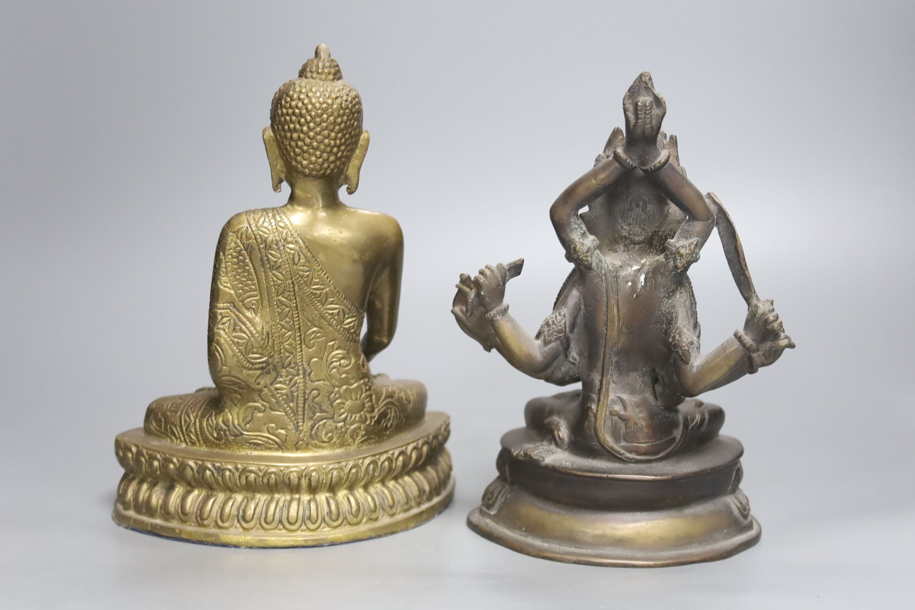 A bronze tantric figure of a Bodhisattva, 19.5cm and a similar figure of Buddha